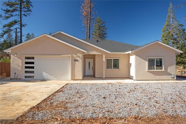 ranch-style home featuring a garage