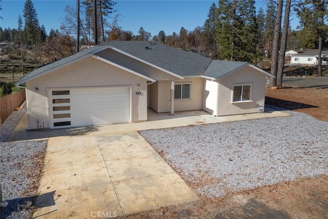 ranch-style house featuring a garage