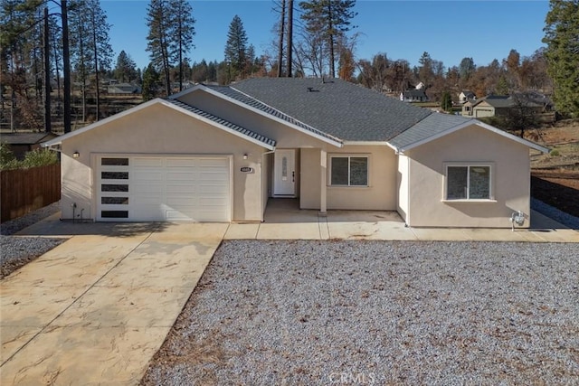 ranch-style home featuring a garage