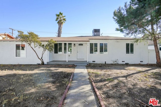 ranch-style house with central air condition unit