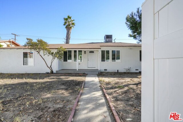 ranch-style home featuring central air condition unit