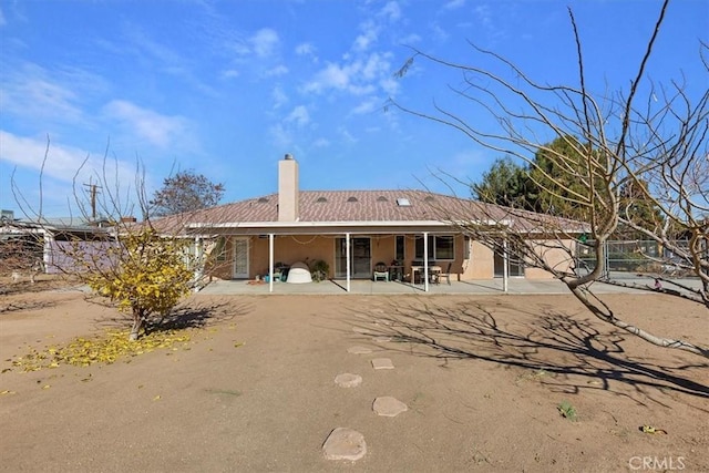 back of property featuring a patio