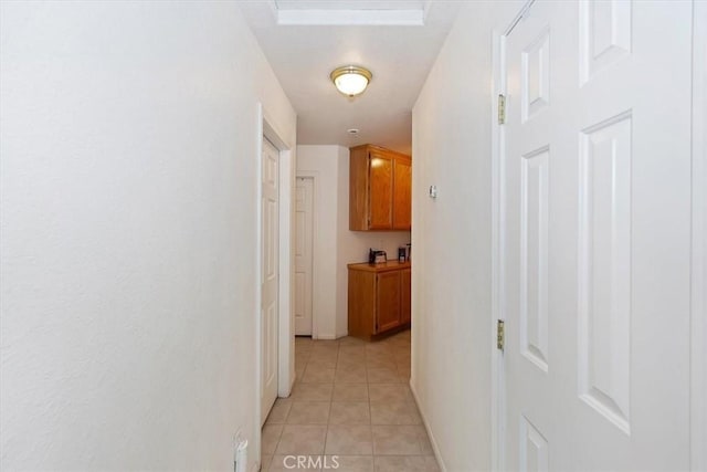 hallway with light tile patterned floors