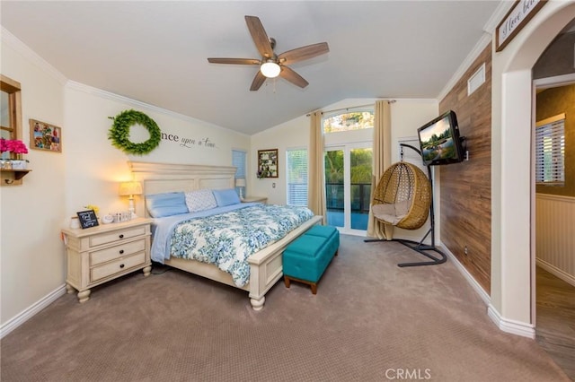 carpeted bedroom with lofted ceiling, access to exterior, crown molding, ceiling fan, and wooden walls