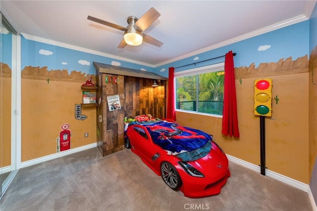 bedroom with ceiling fan, ornamental molding, and carpet flooring