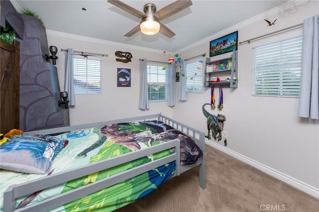 bedroom with ceiling fan, ornamental molding, and carpet floors