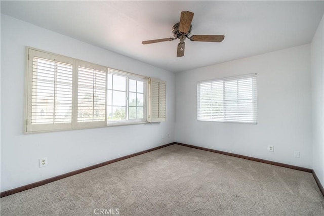 carpeted empty room with ceiling fan