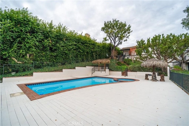 view of pool with a wooden deck