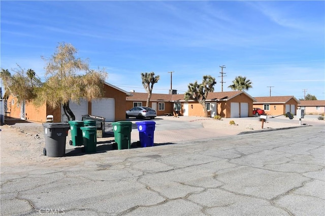 6424 Athol Ave Unit 29, Palms, CA 92277 - ranch-style house featuring an attached garage, stucco siding, and a residential view