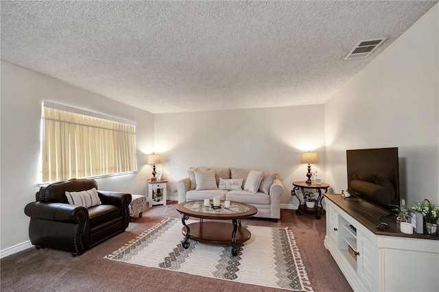 living room with dark carpet and a textured ceiling