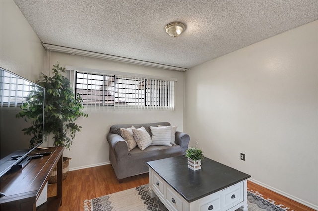 3504 Rainbow Ln, Highland, CA 92346 - living area with a textured ceiling and wood finished floors