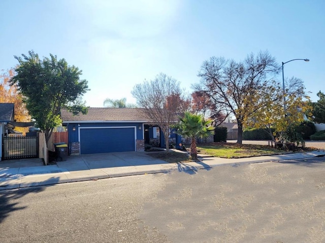 ranch-style house featuring a garage