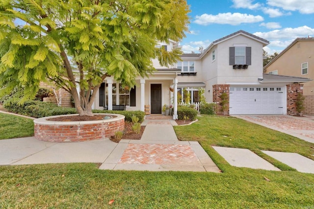 view of front of home featuring a garage and a front yard