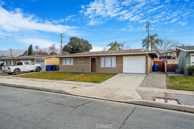 single story home with a garage and a front yard