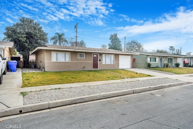 ranch-style home with a garage and a front yard