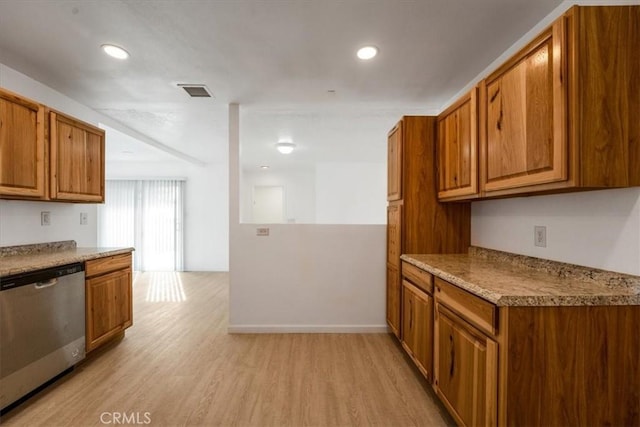 kitchen with light hardwood / wood-style flooring and dishwasher