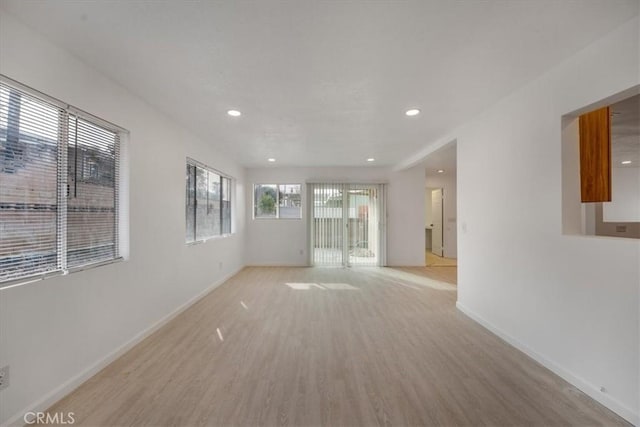 unfurnished room with light hardwood / wood-style flooring