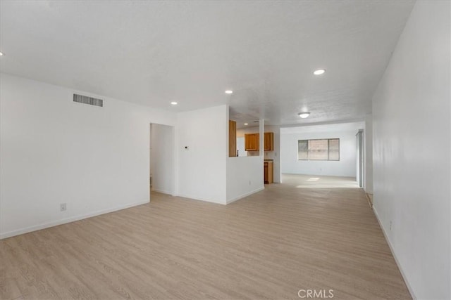 unfurnished living room featuring light wood-type flooring