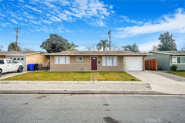 ranch-style home with a garage and a front yard