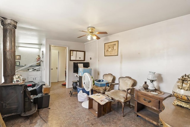 living area with ceiling fan