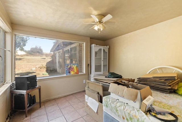 misc room featuring ceiling fan and light tile patterned flooring