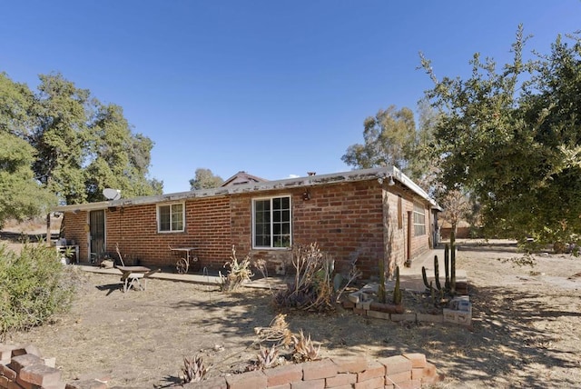 back of house featuring a patio