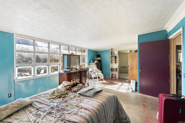 bedroom with a textured ceiling, concrete floors, and ornamental molding