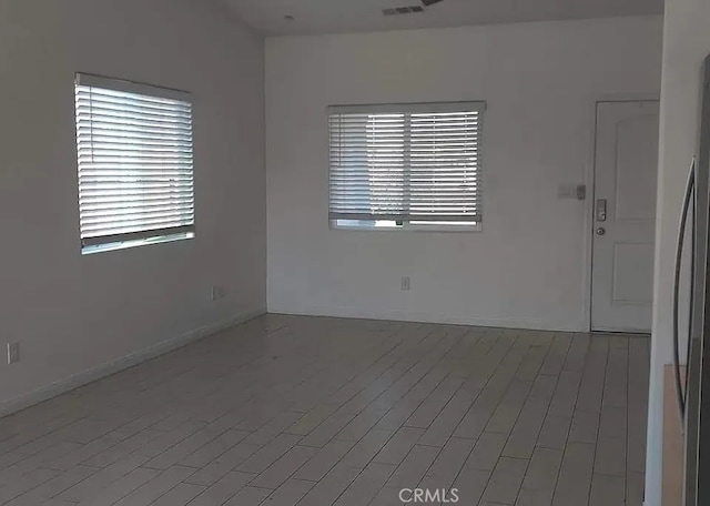 spare room with hardwood / wood-style floors