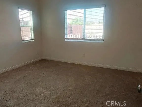 empty room featuring carpet flooring