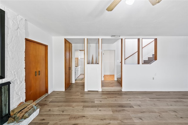 interior space with light wood-type flooring and ceiling fan