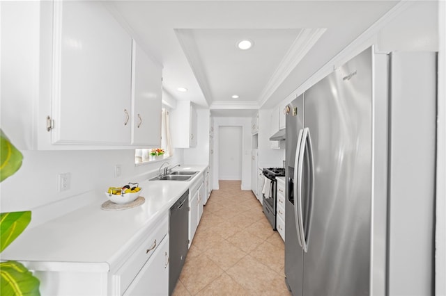 kitchen featuring crown molding, sink, a tray ceiling, white cabinetry, and stainless steel appliances