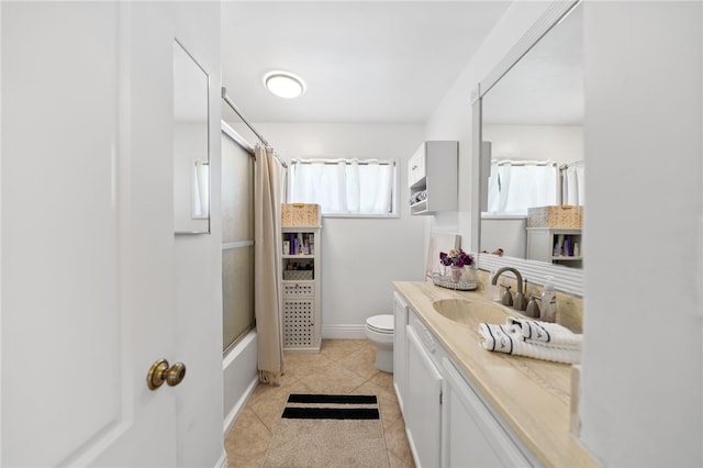 full bathroom with tile patterned flooring, vanity, shower / bath combo, and toilet