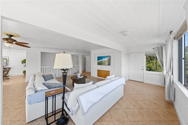 tiled living room featuring ceiling fan