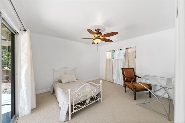 carpeted bedroom with access to outside and ceiling fan