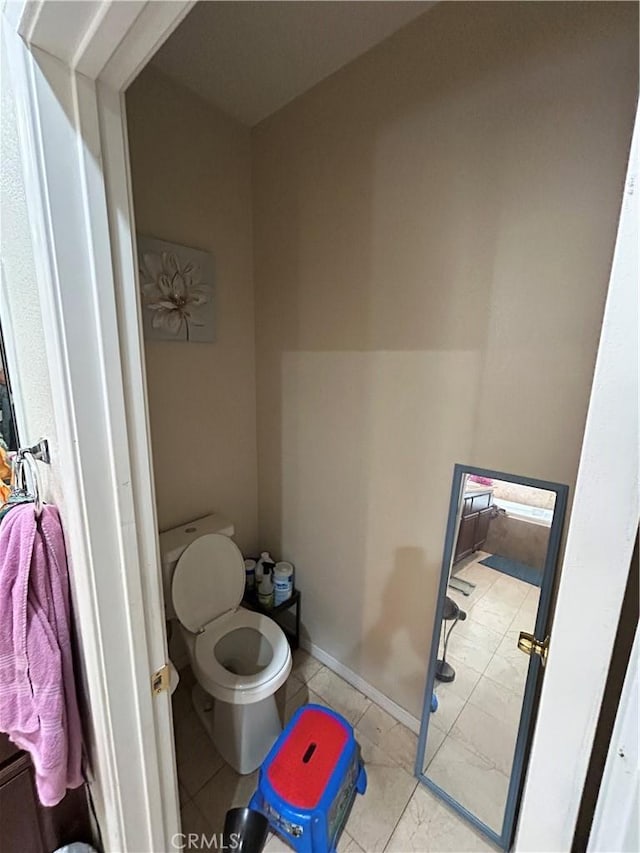 bathroom featuring toilet