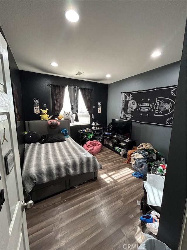 bedroom featuring hardwood / wood-style flooring