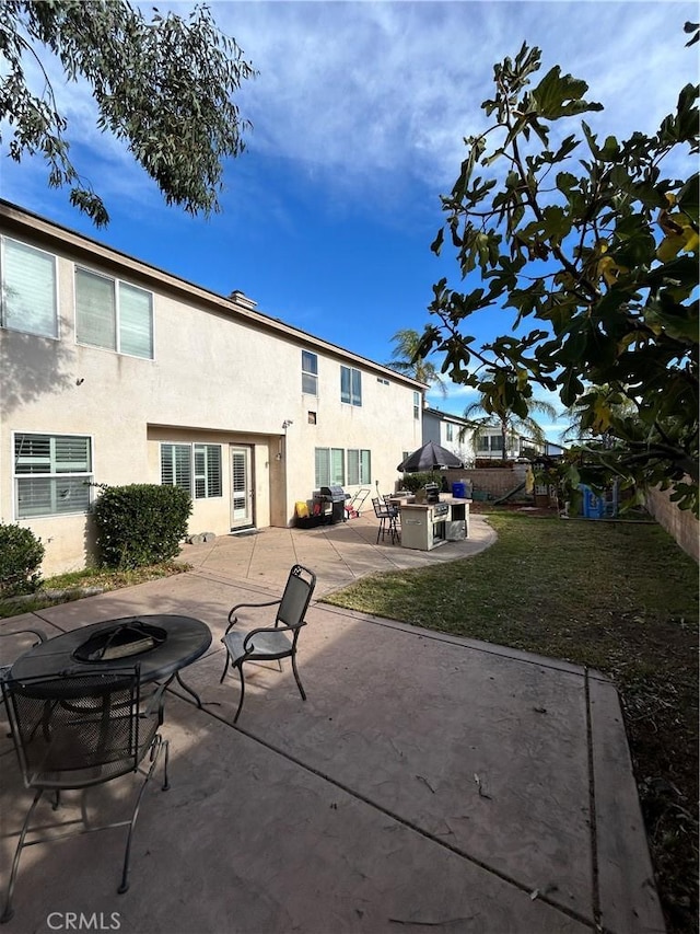 rear view of property with a patio