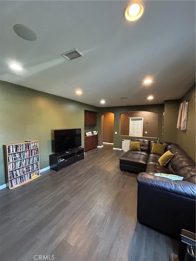 living room with dark wood-type flooring