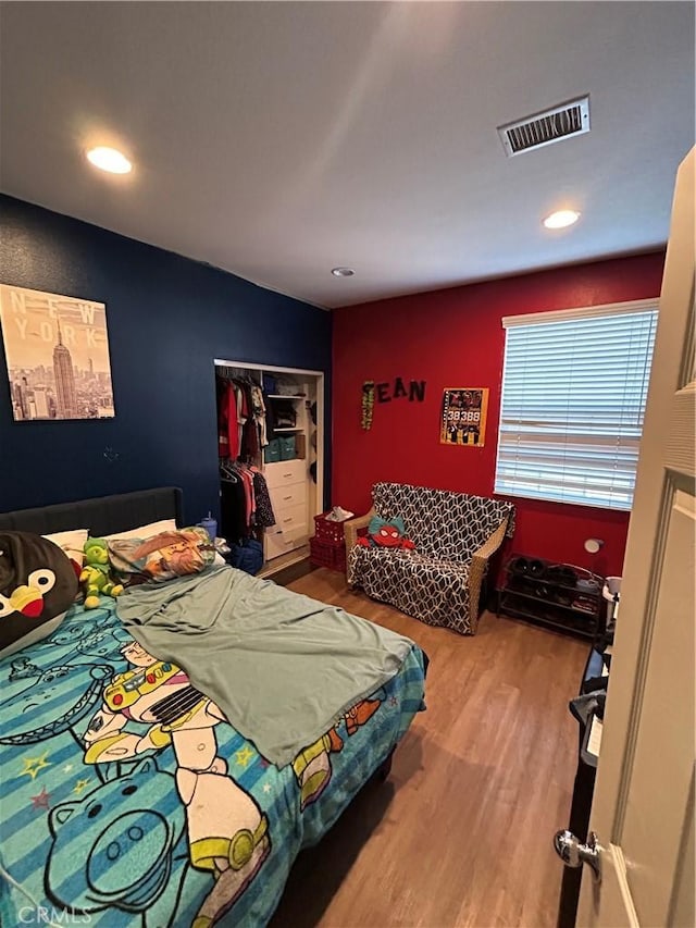 bedroom with hardwood / wood-style flooring