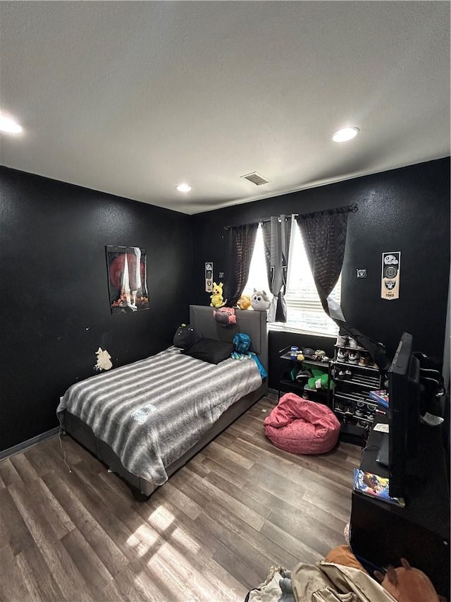 bedroom featuring hardwood / wood-style flooring