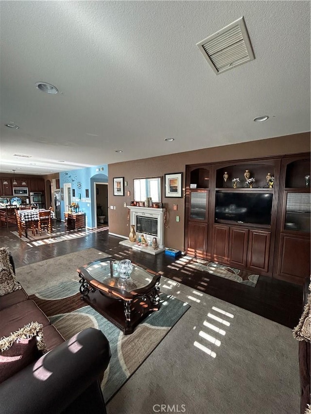 living room featuring a textured ceiling