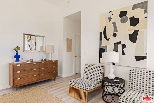 sitting room featuring light hardwood / wood-style floors