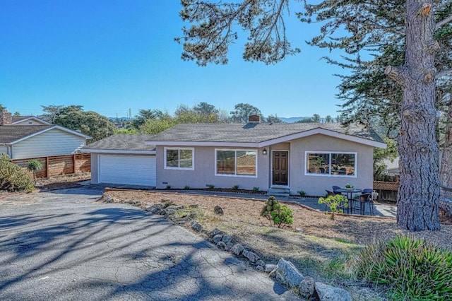 ranch-style home with a garage