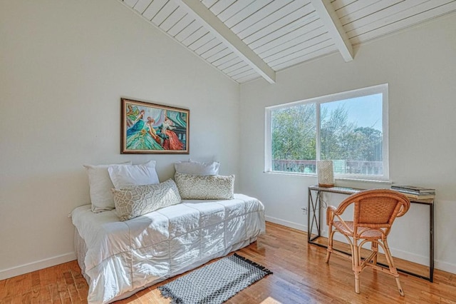 sitting room with wood ceiling, light hardwood / wood-style flooring, and lofted ceiling with beams