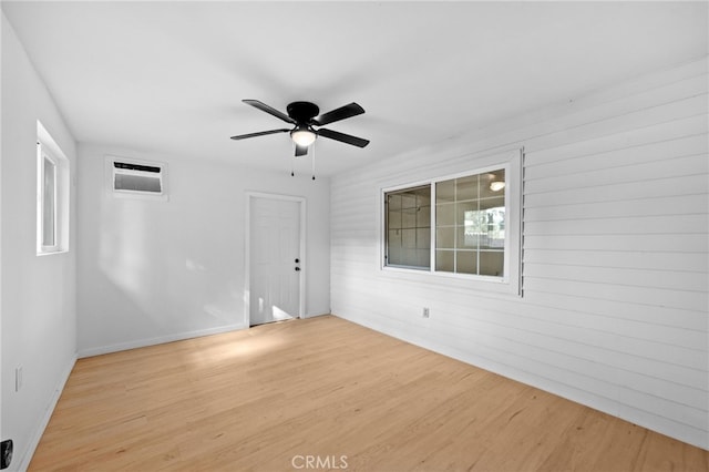 spare room featuring ceiling fan and light wood-type flooring