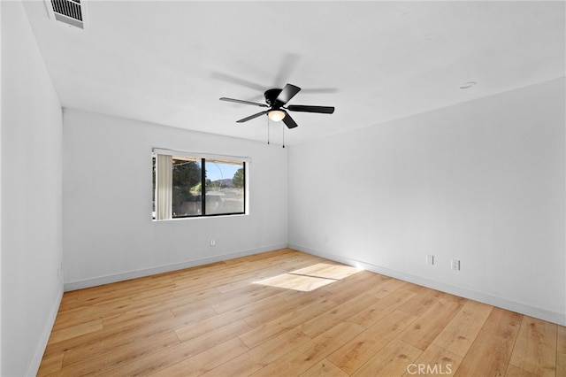 spare room with ceiling fan and light hardwood / wood-style floors