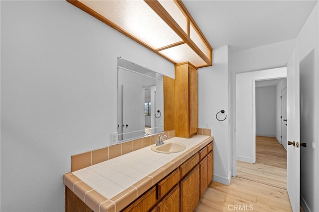 bathroom featuring vanity and wood-type flooring