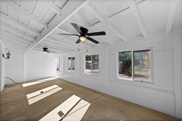 unfurnished sunroom with ceiling fan and beamed ceiling