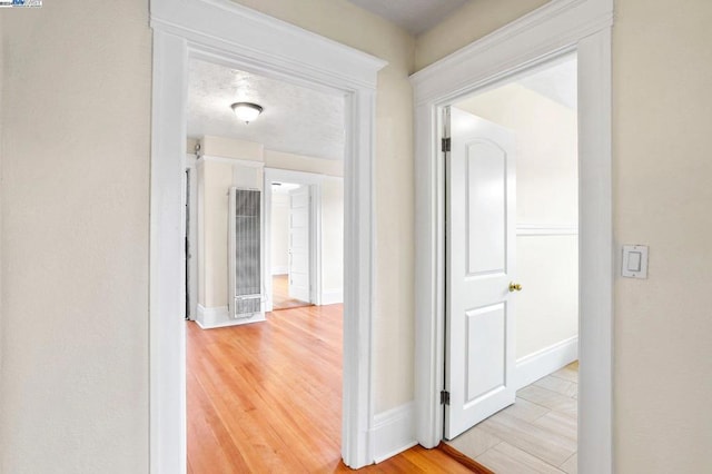 hallway featuring light hardwood / wood-style flooring