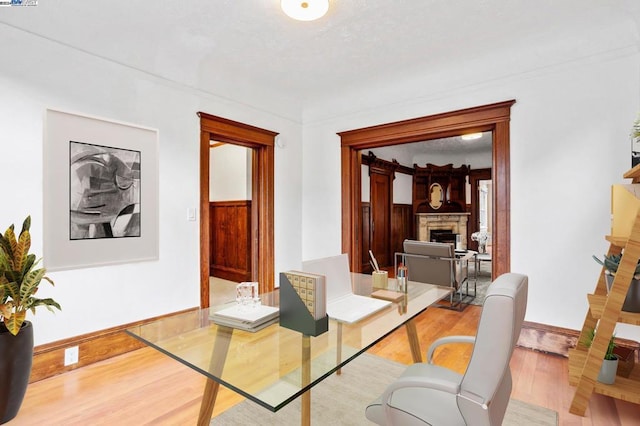 dining space with light hardwood / wood-style floors